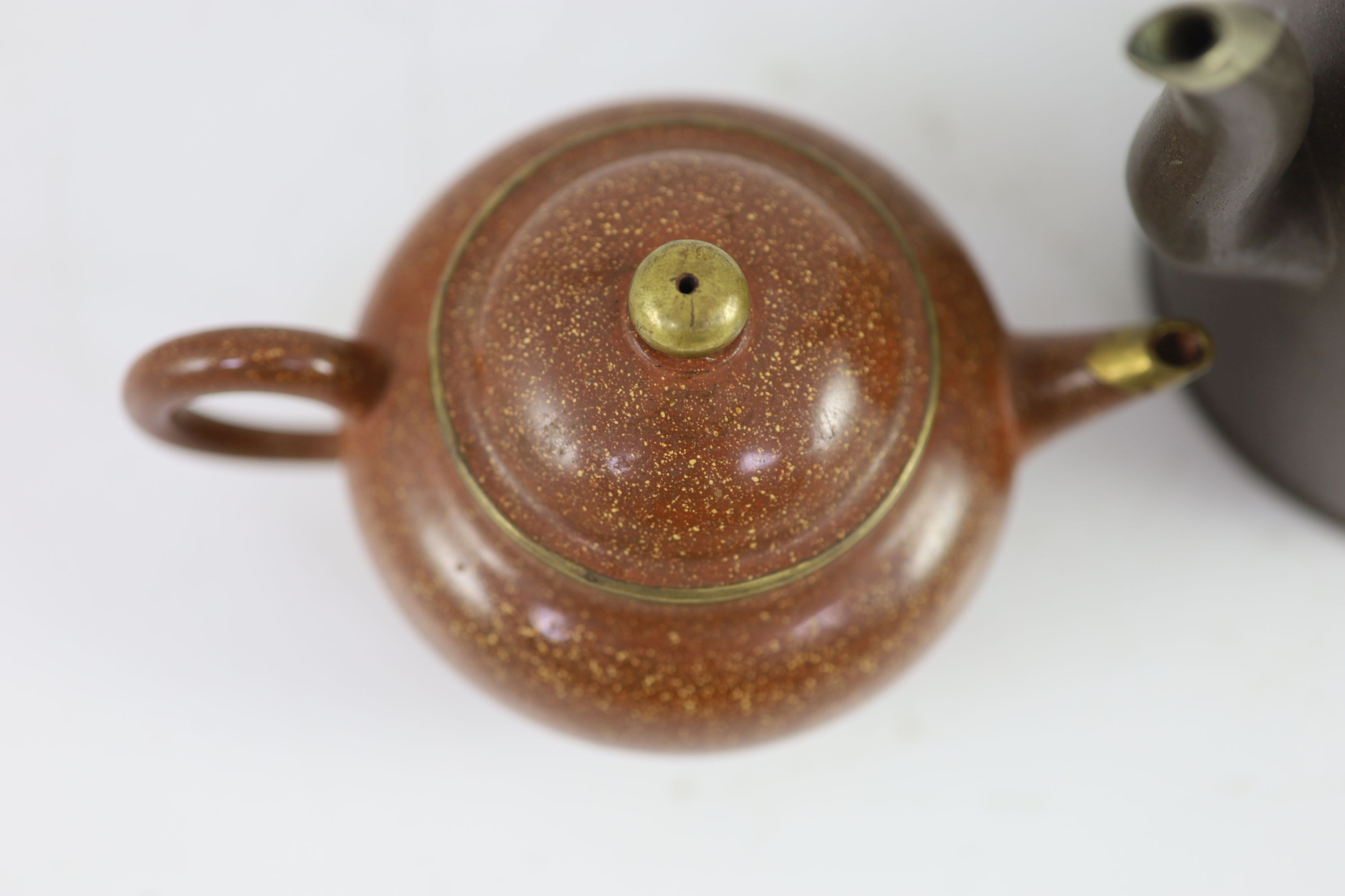 Two Yixing polished teapots made for the Thai market, late 19th century, 19.5 and 9.5 cm high